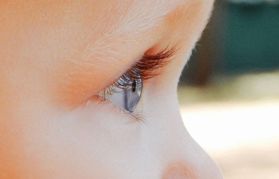 A close-up of a baby's eye, showcasing the innocence and curiosity in their gaze.