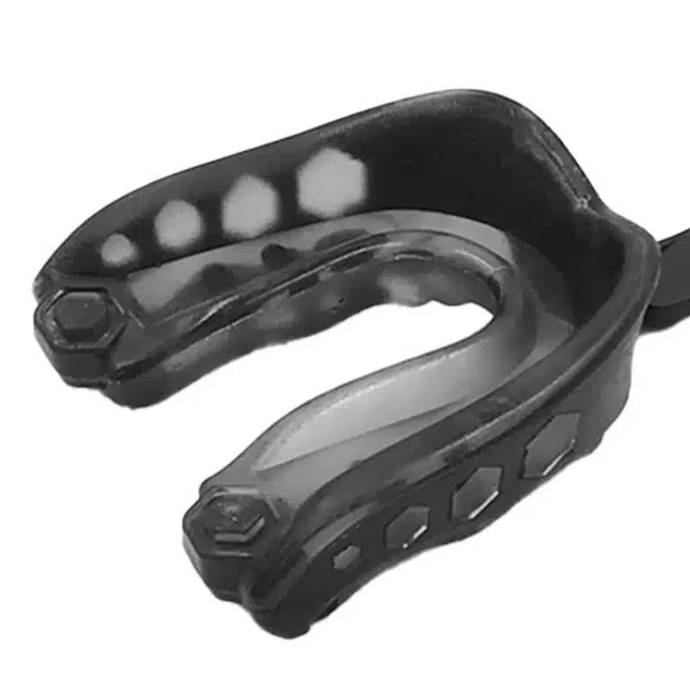 a mouth guard, in black and white, emphasizing its role in safeguarding precious smiles.