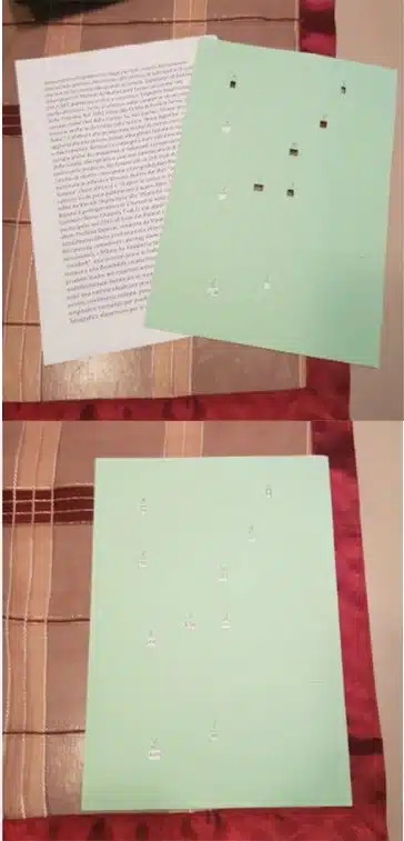 Two sheets of hole-filled paper placed on top of each other