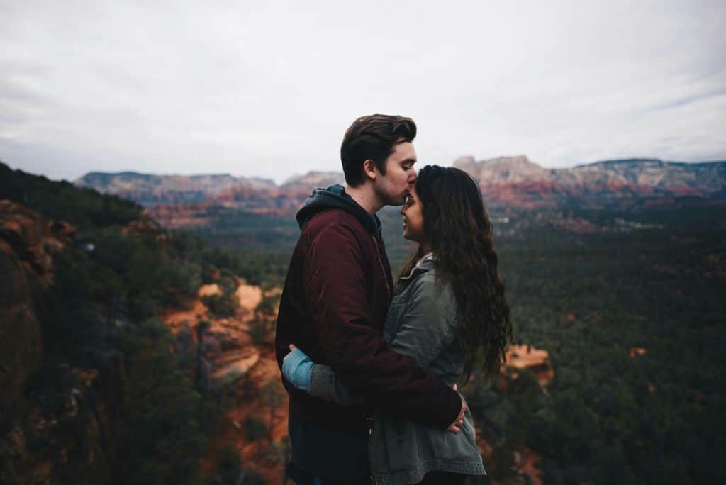 A couple in Sedona during their engagement session, capturing their love amidst the beautiful scenery