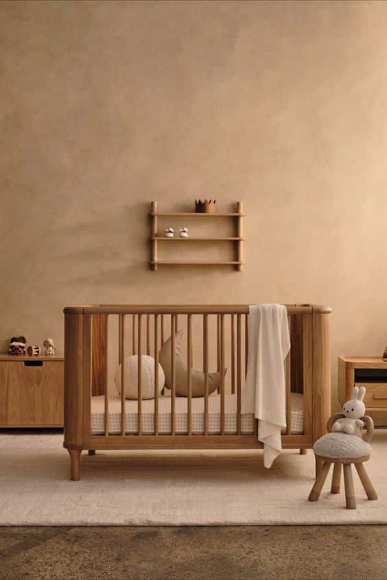 A cozy baby's room with a wooden crib
